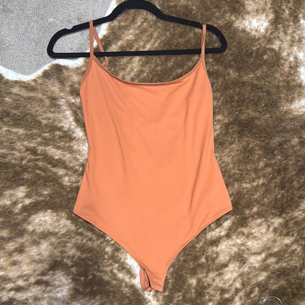 Free People Orange cross back bodysuit size small